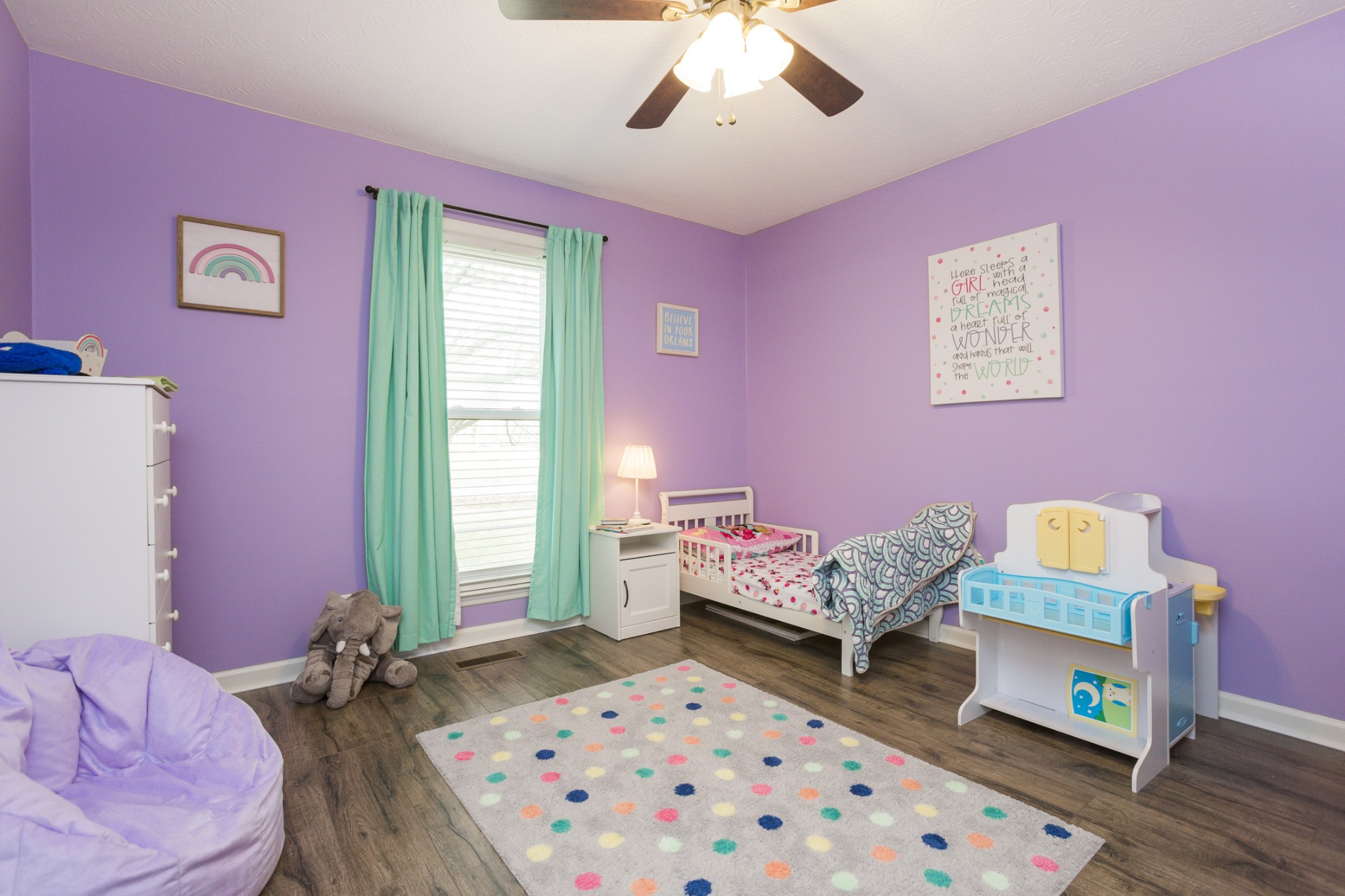 6045 Ebenezer Road Greenbrier, TN 37073 - Photo 23 of 30 a bedroom with furniture and a wooden floor