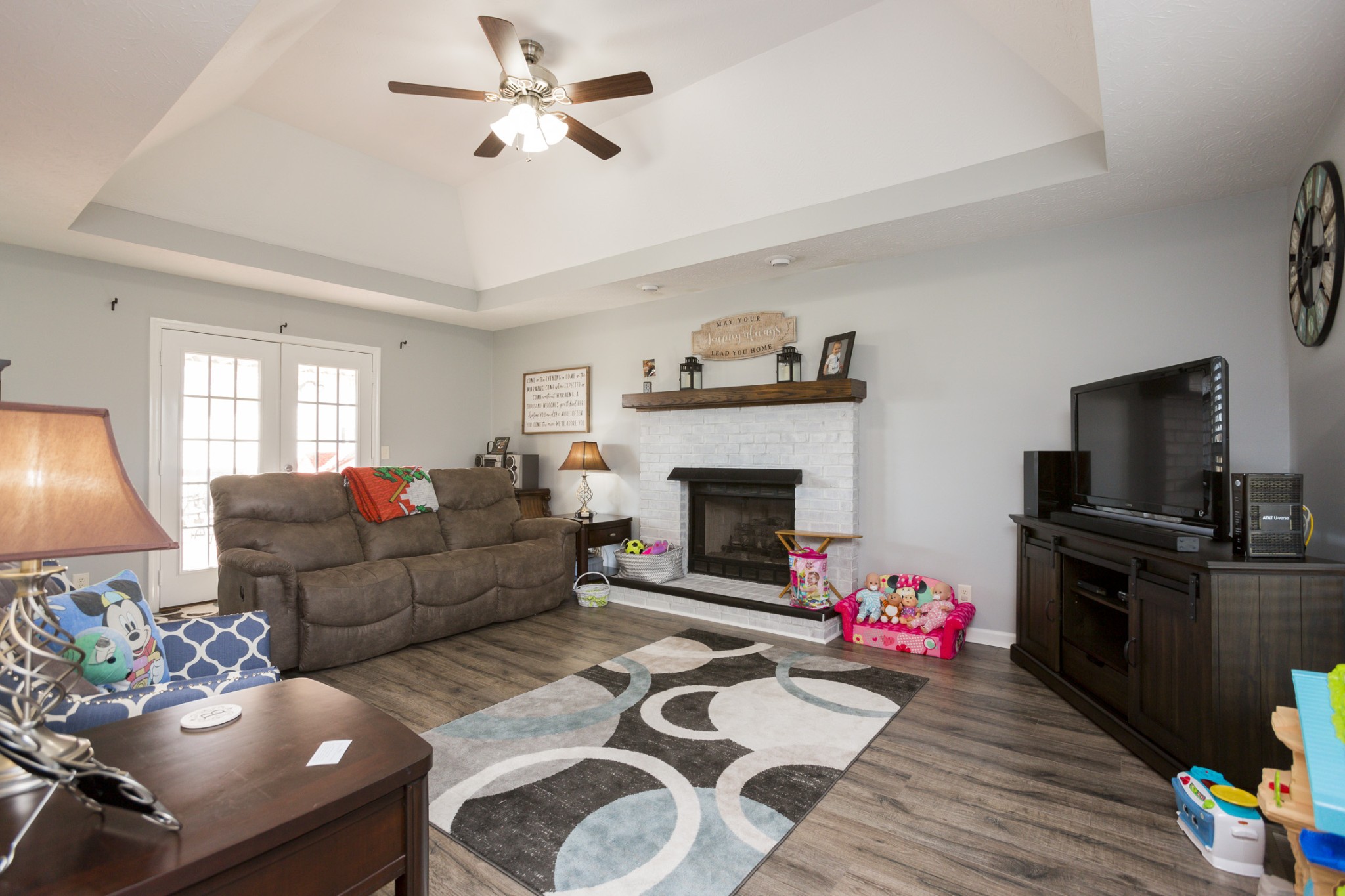6045 Ebenezer Road Greenbrier, TN 37073 - Photo 5 of 30 a living room with furniture a flat screen tv and a fireplace
