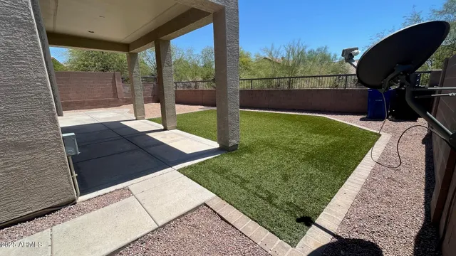 a view of a backyard with sitting area