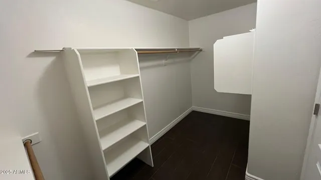 a view of an empty walk in closet