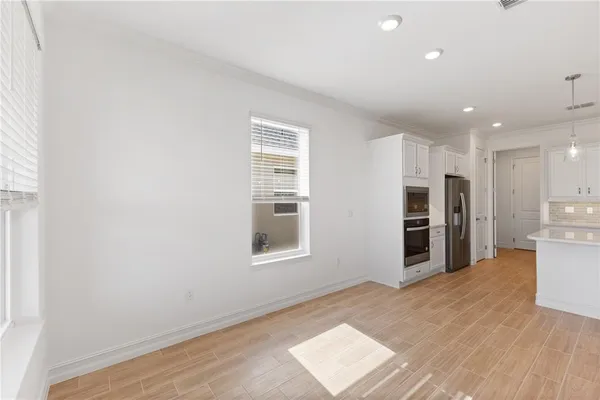 a view of kitchen and wooden floor