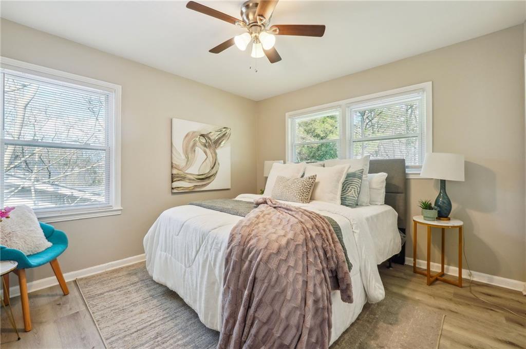 2287 Mulberry Street Atlanta, GA 30344 - Photo 13 of 18 a bedroom with a bed and wooden floor