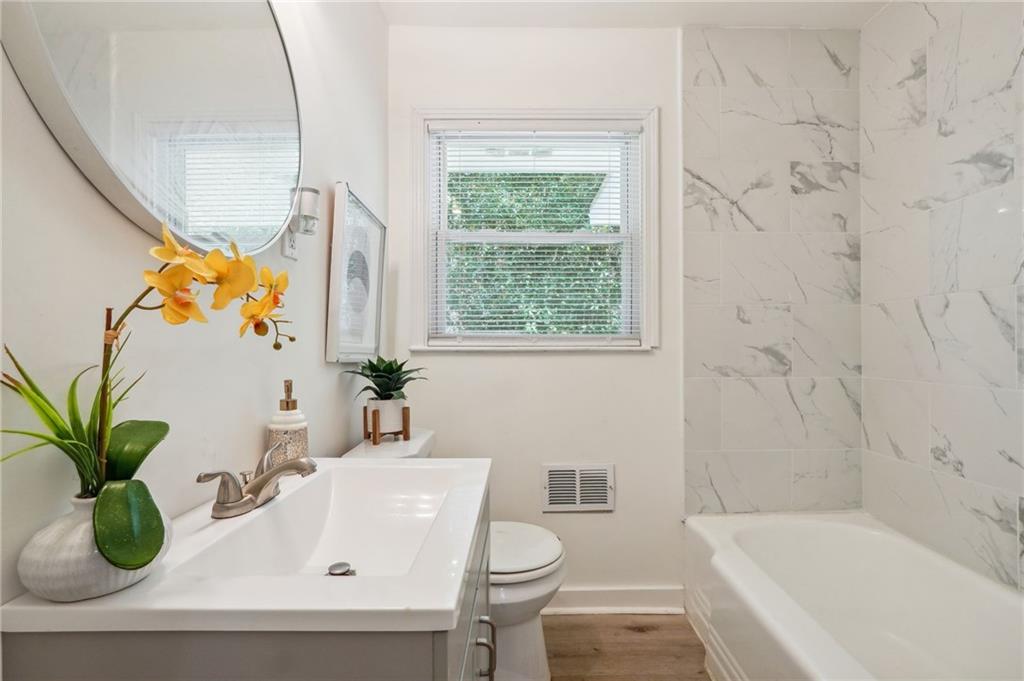 2287 Mulberry Street Atlanta, GA 30344 - Photo 14 of 18 a bathroom with a sink a toilet and a bathtub