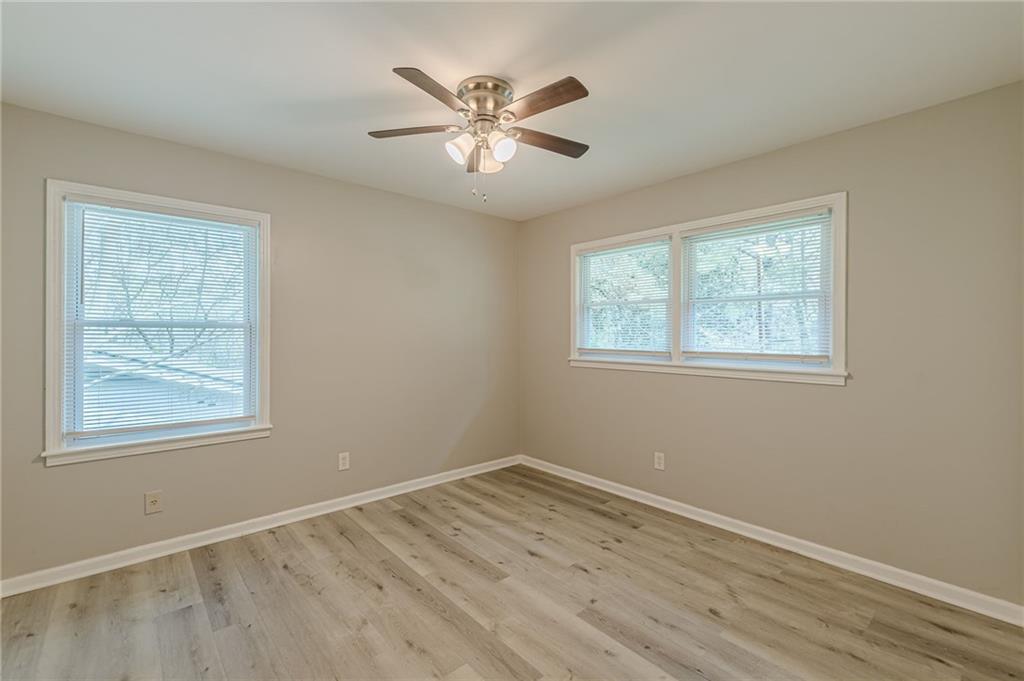 2287 Mulberry Street Atlanta, GA 30344 - Photo 15 of 18 a view of an empty room with wooden floor and a window