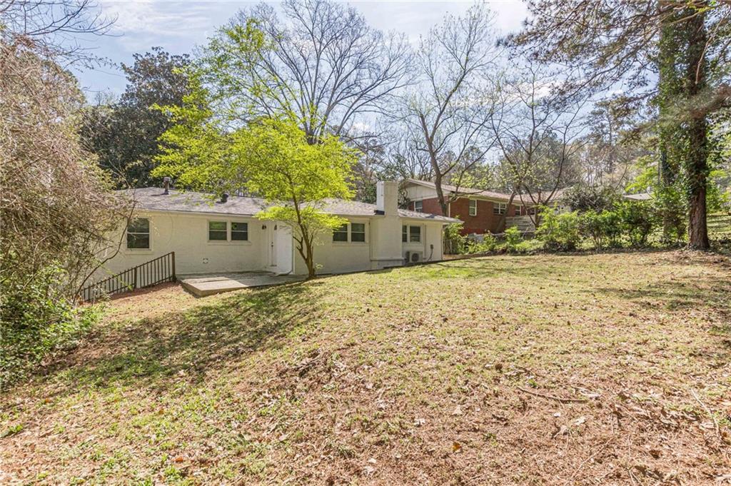 2287 Mulberry Street Atlanta, GA 30344 - Photo 18 of 18 a backyard of a house with a large tree