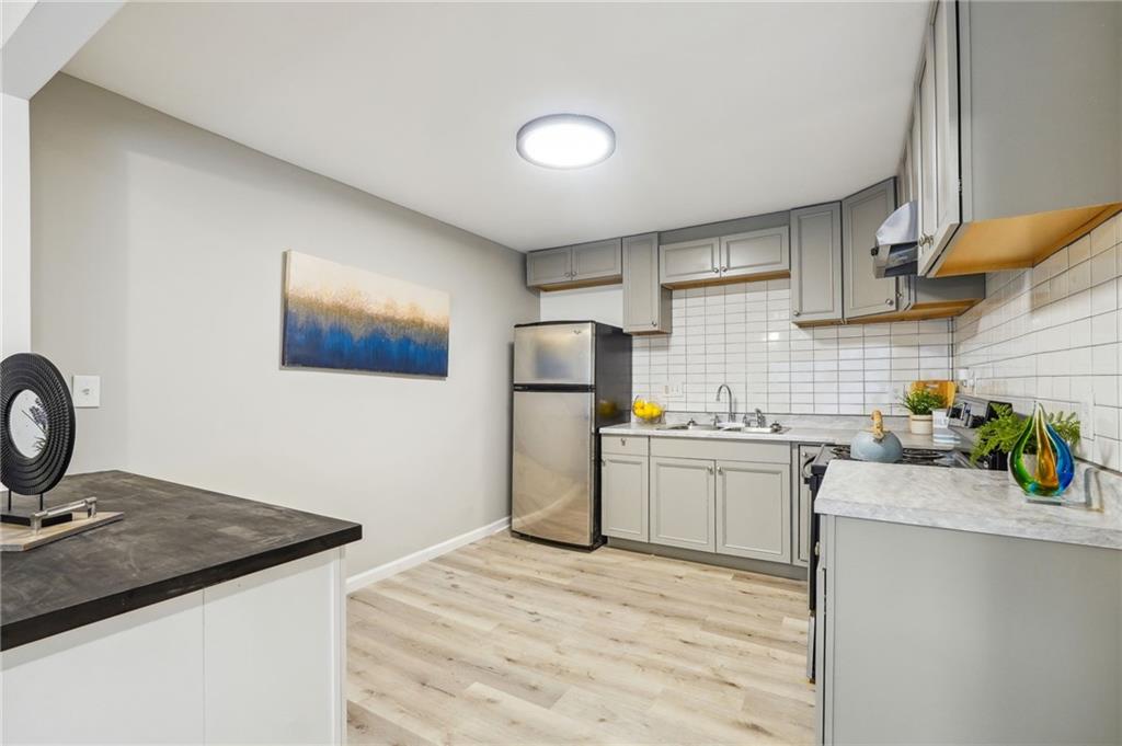 2287 Mulberry Street Atlanta, GA 30344 - Photo 6 of 18 a kitchen with a sink stove and refrigerator