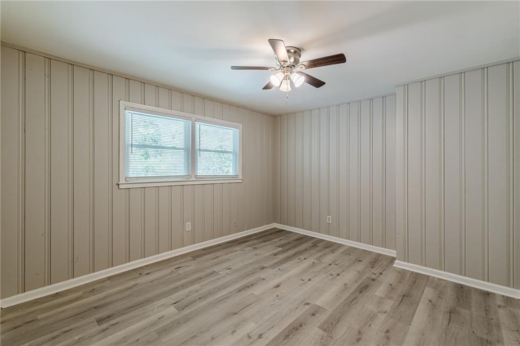2287 Mulberry Street Atlanta, GA 30344 - Photo 8 of 18 a view of an empty room with wooden floor and a window