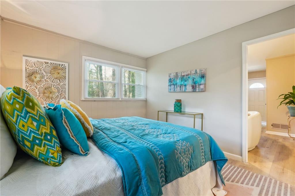 2287 Mulberry Street Atlanta, GA 30344 - Photo 9 of 18 a bedroom with a bed and a painting on the wall