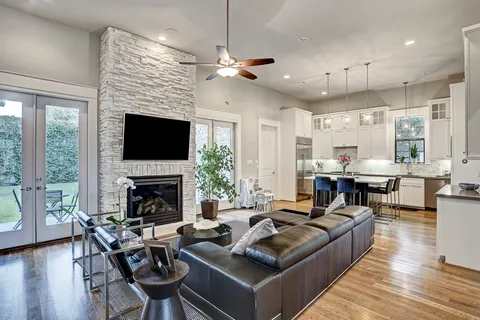 a living room with furniture fireplace and a flat screen tv