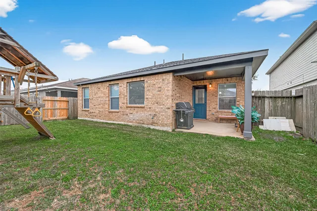 a house view with a backyard space