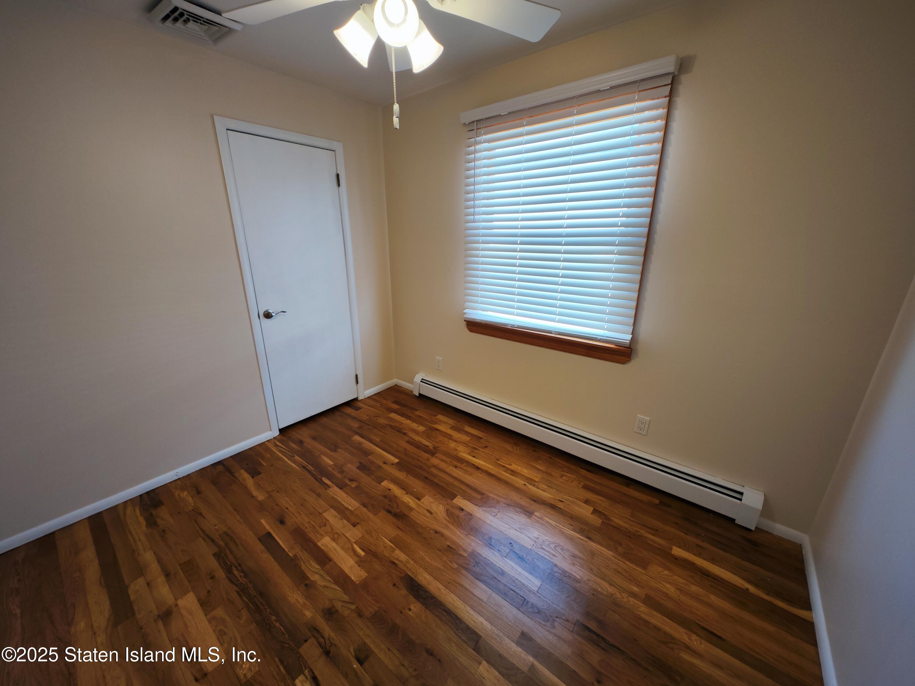 517 Rathbun Avenue Staten Island, NY 10312 - Photo 12 of 28 a view of an empty room with a window