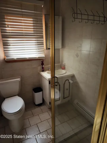 a bathroom with a toilet and a sink