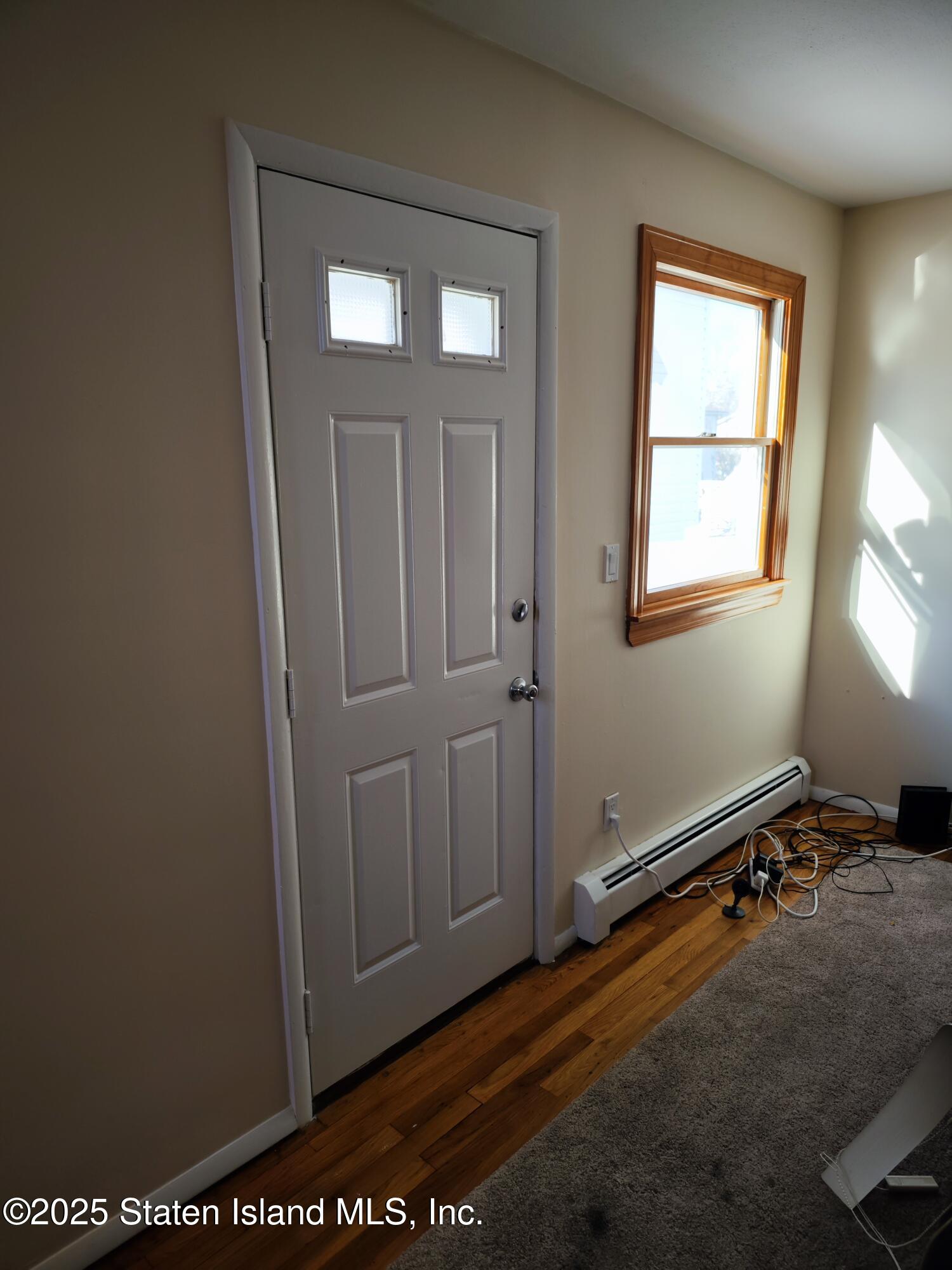 517 Rathbun Avenue Staten Island, NY 10312 - Photo 15 of 28 an empty room with windows