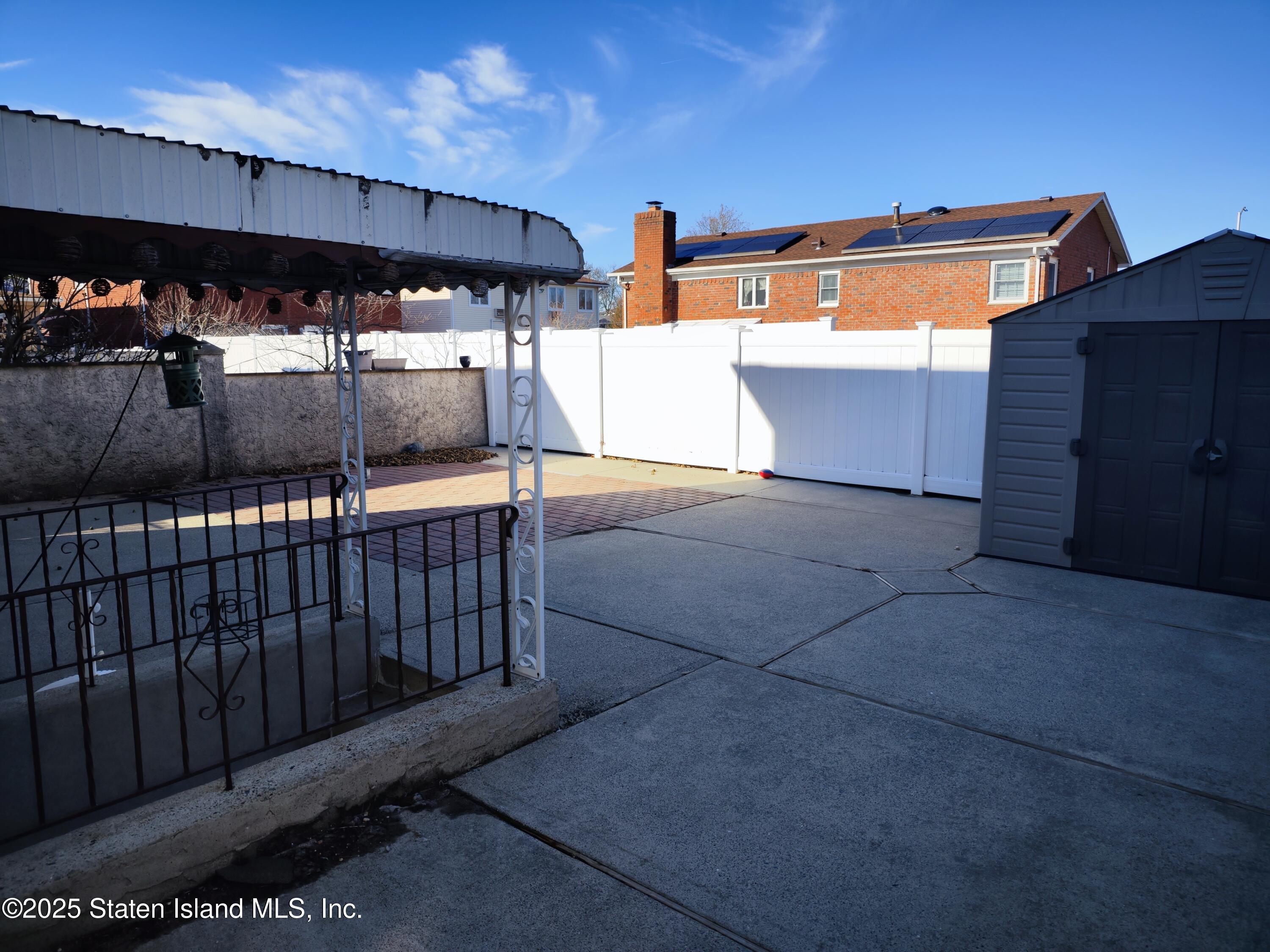 517 Rathbun Avenue Staten Island, NY 10312 - Photo 17 of 28 a view of outdoor space with deck and flat screen tv
