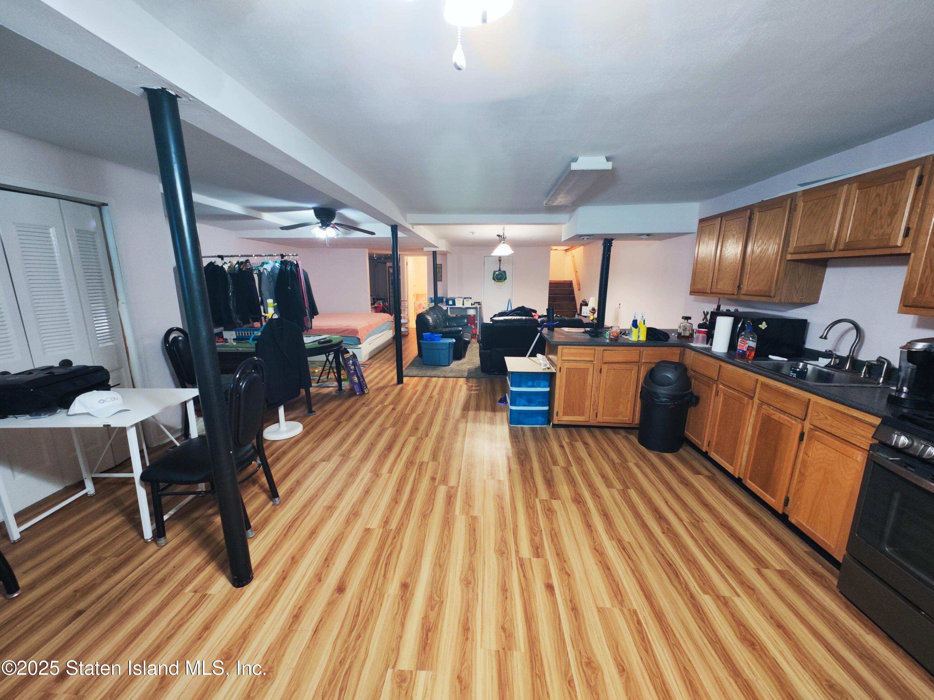 517 Rathbun Avenue Staten Island, NY 10312 - Photo 20 of 28 a open kitchen with stainless steel appliances granite countertop a stove and a wooden floors