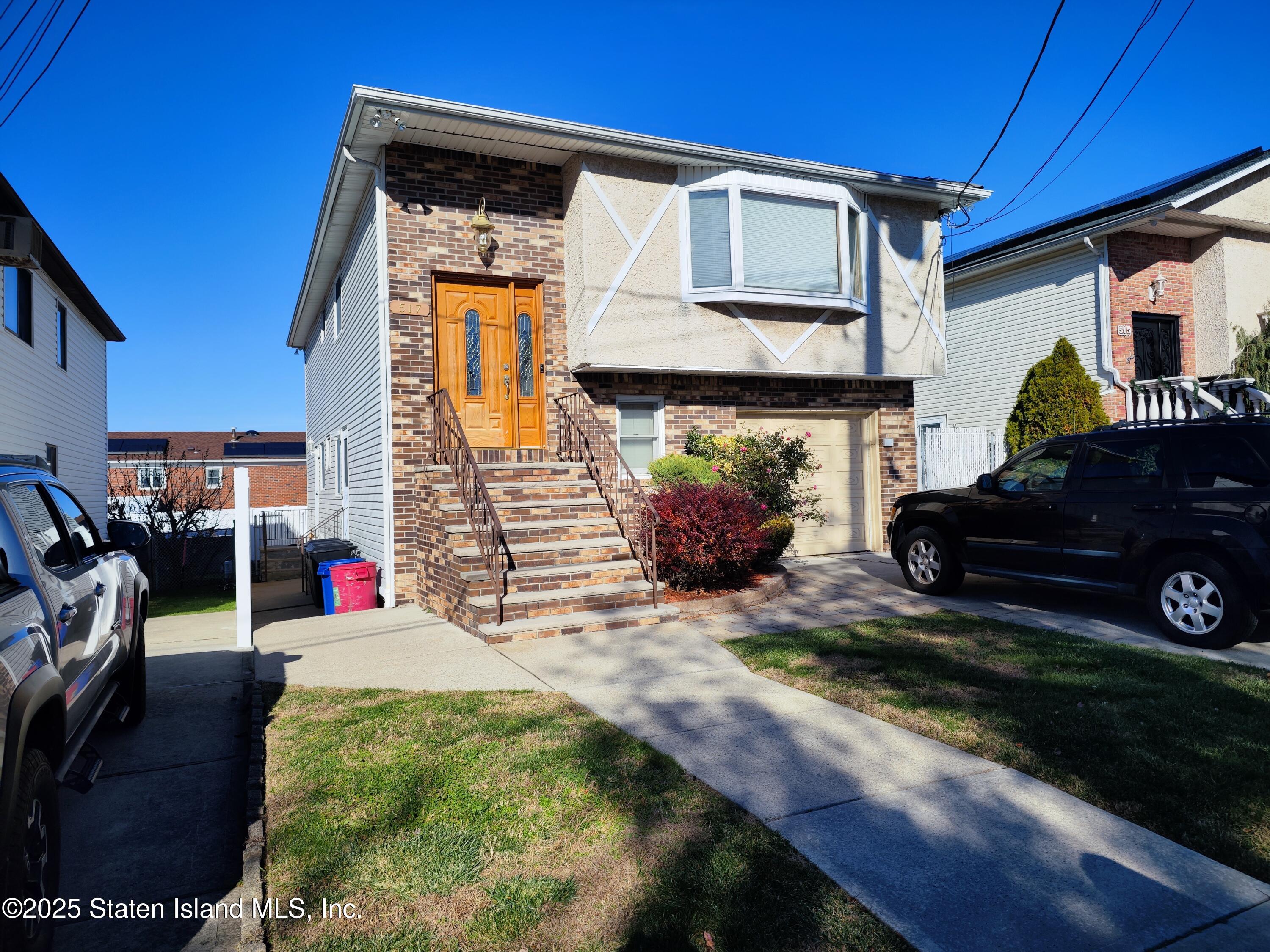 517 Rathbun Avenue Staten Island, NY 10312 - Photo 2 of 28 a front view of a house with garden