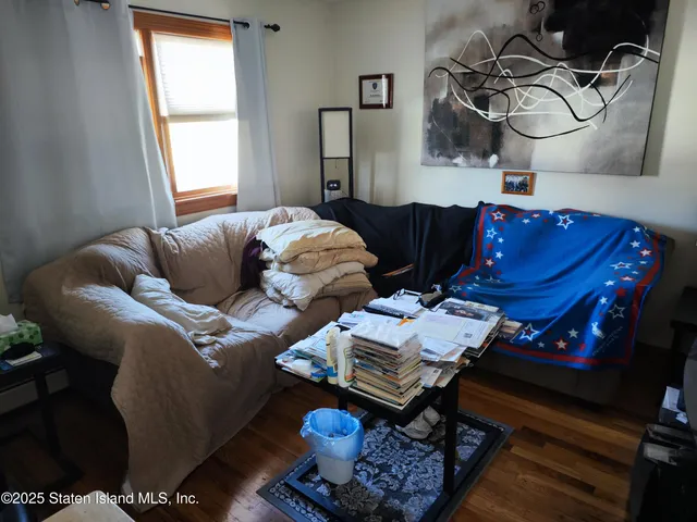 a bedroom with furniture and a window