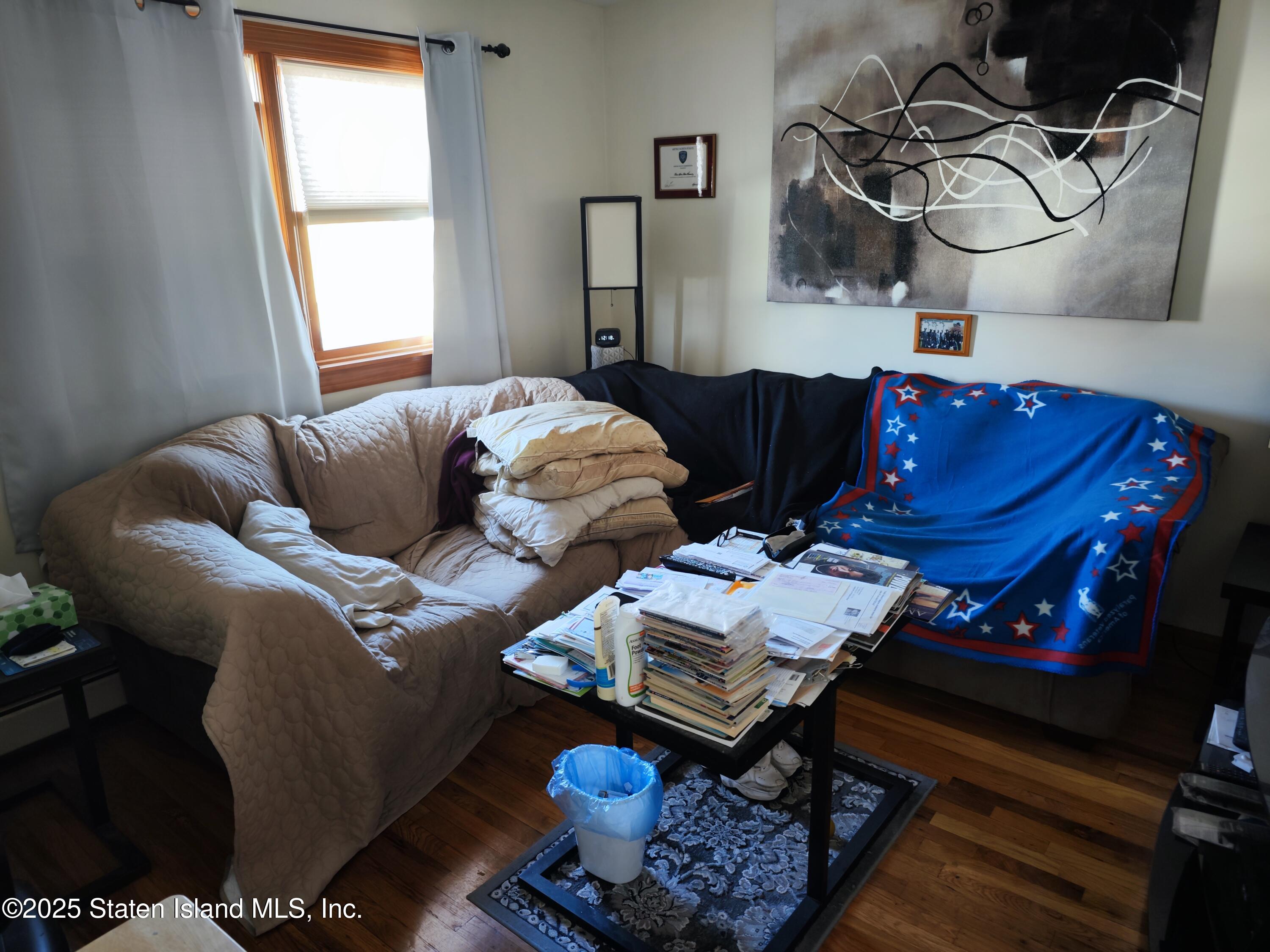 517 Rathbun Avenue Staten Island, NY 10312 - Photo 26 of 28 a bedroom with furniture and a window