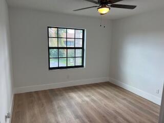 102 Pinecrest Circle, Unit C Jupiter, FL 33458 - Photo 27 of 38 an empty room with a window