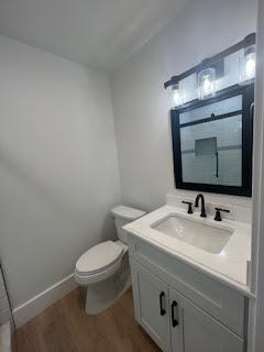 102 Pinecrest Circle, Unit C Jupiter, FL 33458 - Photo 38 of 38 a bathroom with a toilet sink and mirror