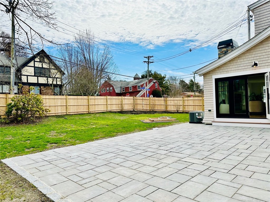 166 Ruggles Avenue Newport, RI 02840 - Photo 46 of 50 Lovely large private backyard with indoor outdoor living with large opening door between the living and back patio.