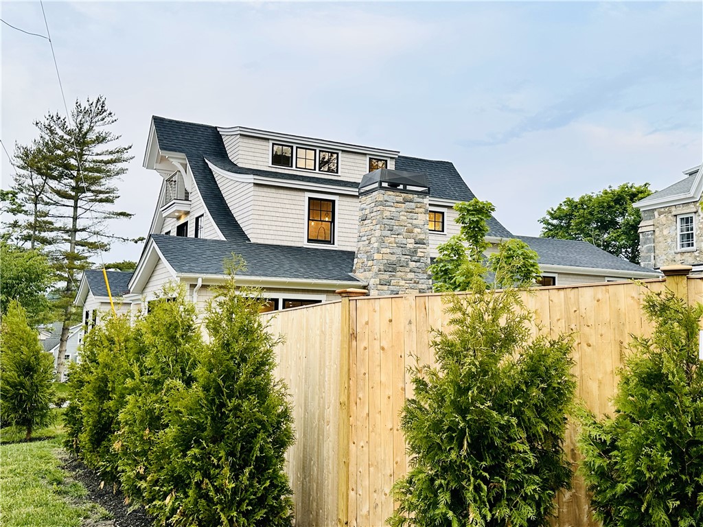 166 Ruggles Avenue Newport, RI 02840 - Photo 47 of 50 New fence with evergreen trees adds to the privacy and character of this new home.