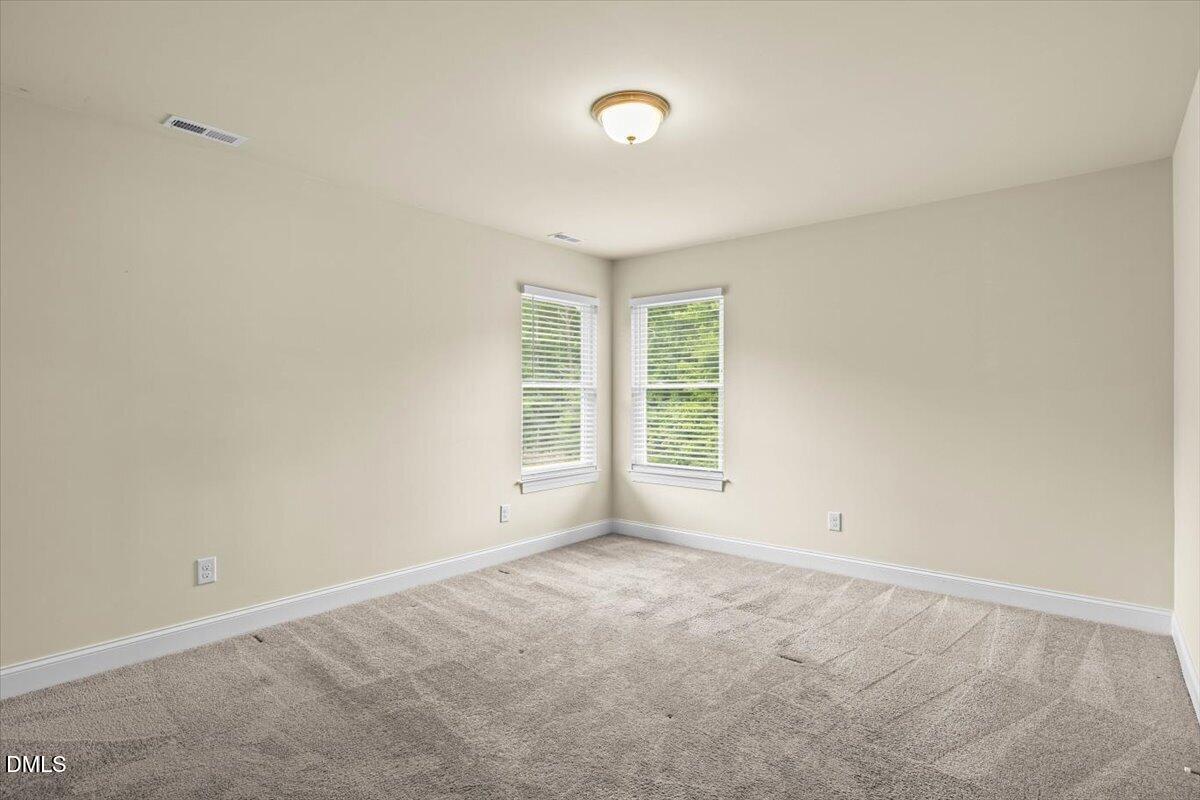 704 Haw River Hopedale Road Burlington, NC 27217 - Photo 30 of 49 an empty room with windows