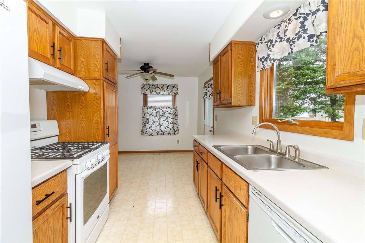1893 Irene Road Sandwich, IL 60548 - Photo 8 of 22 a kitchen with stainless steel appliances granite countertop a sink stove and refrigerator