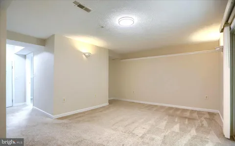 an empty room with a bathroom