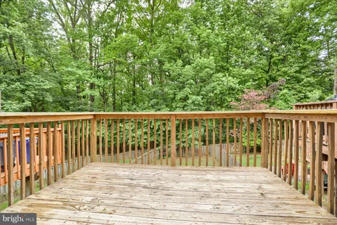 a view of a balcony with wooden floor