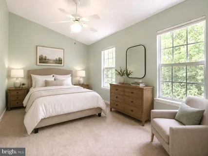 a bedroom with a bed and a couch