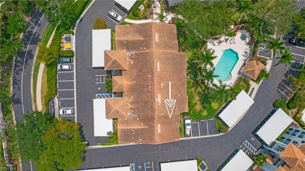 470 Bermuda Cove Way, Unit 2104 Naples, FL 34110 - Photo 30 of 35 Drone / aerial view of a pool area