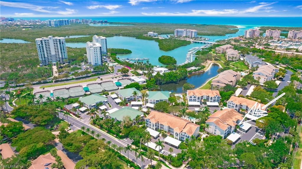 470 Bermuda Cove Way, Unit 2104 Naples, FL 34110 - Photo 31 of 35 Aerial overview of property's location featuring a nearby body of water and nearby urban area
