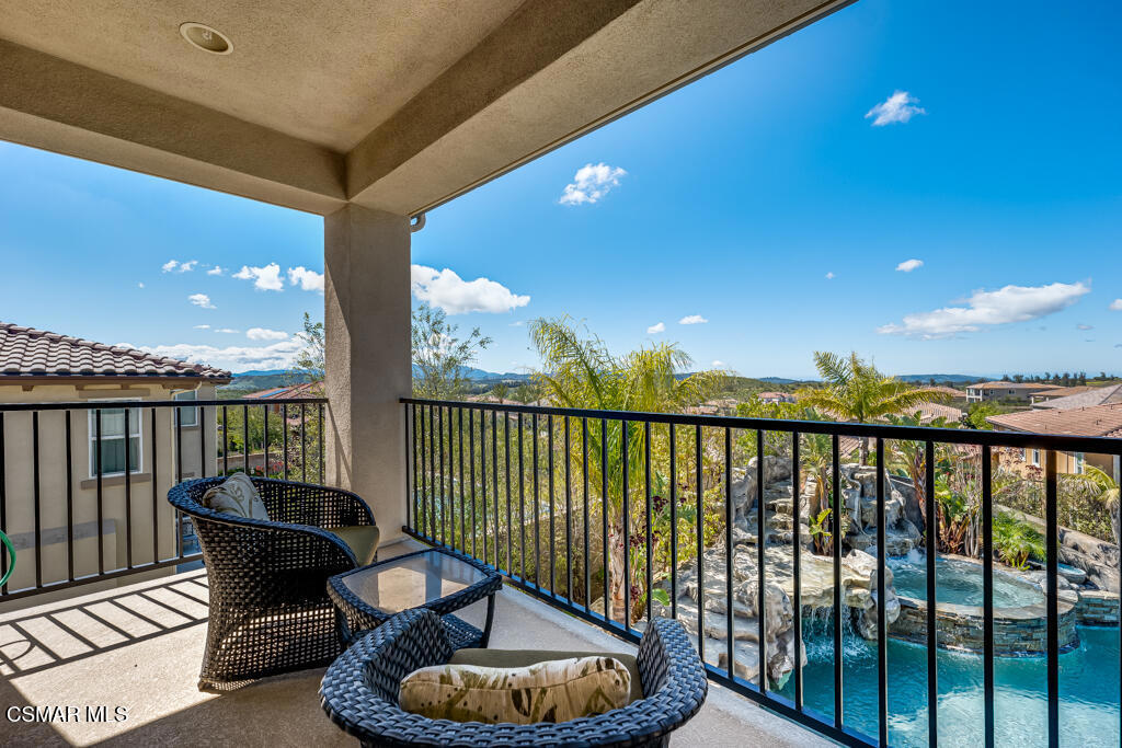 7377 Woods Court Moorpark, CA 93021 - Photo 13 of 29 a view of a balcony with chair and wooden floor