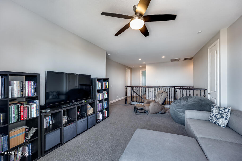 7377 Woods Court Moorpark, CA 93021 - Photo 18 of 29 a living room with furniture and a flat screen tv