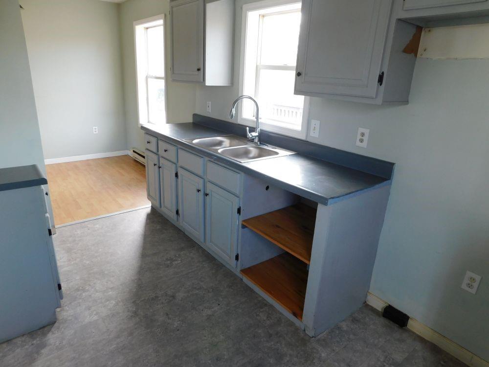 345 Old Ash Road Mercer, PA 16137 - Photo 2 of 10 a kitchen with stainless steel appliances a sink stove and cabinets