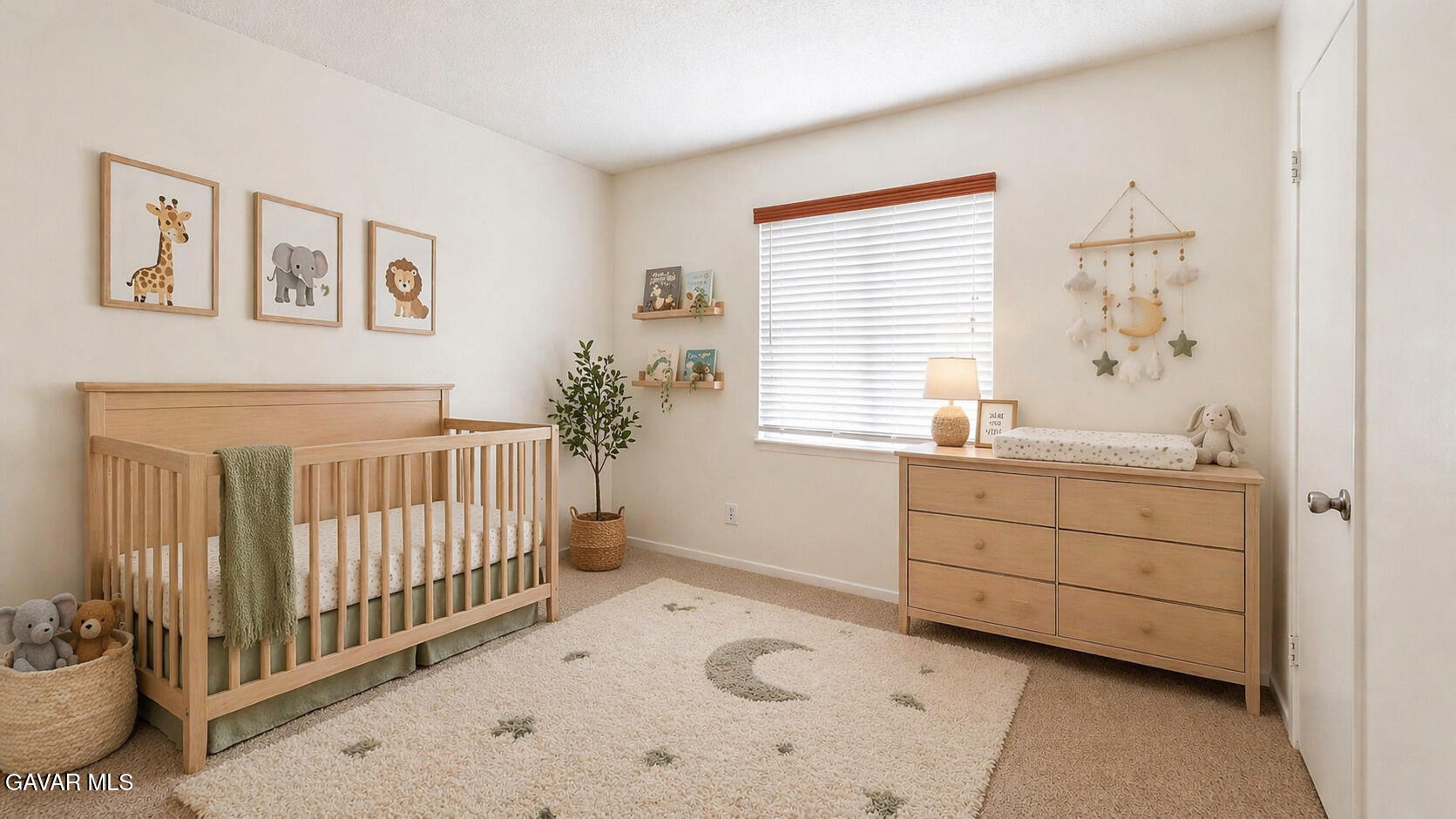 45409 Rodin Avenue Lancaster, CA 93535 - Photo 15 of 17 a room with a baby bed baby crib and a window