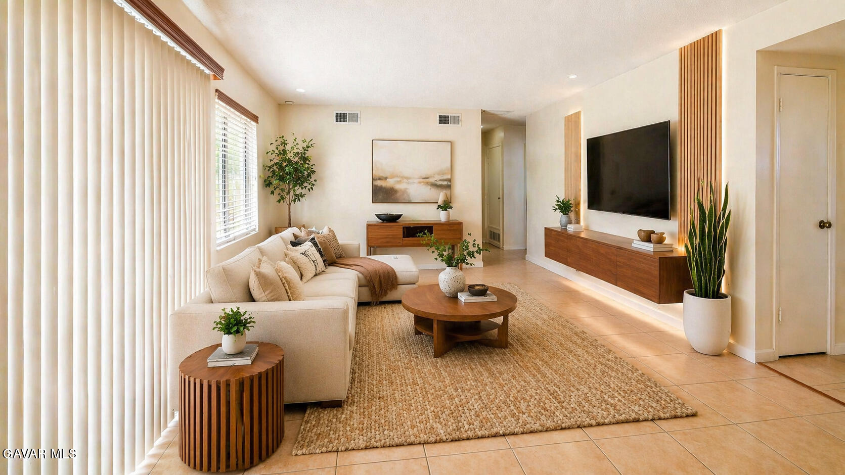 45409 Rodin Avenue Lancaster, CA 93535 - Photo 2 of 17 a living room with furniture and a flat screen tv