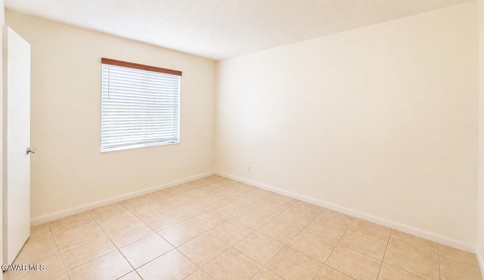 45409 Rodin Avenue Lancaster, CA 93535 - Photo 6 of 17 an empty room with windows