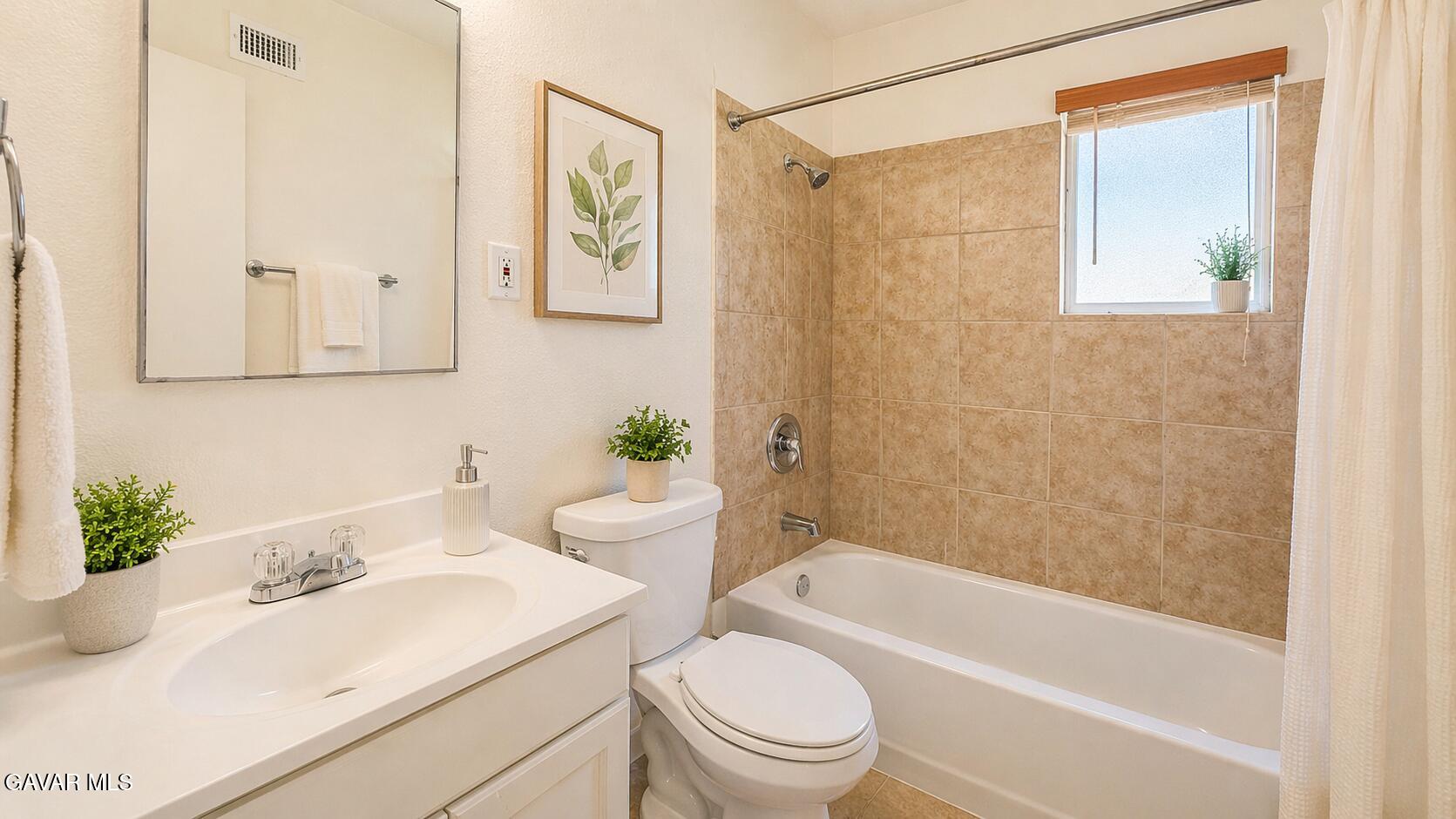 45409 Rodin Avenue Lancaster, CA 93535 - Photo 9 of 17 a bathroom with a sink a toilet and shower