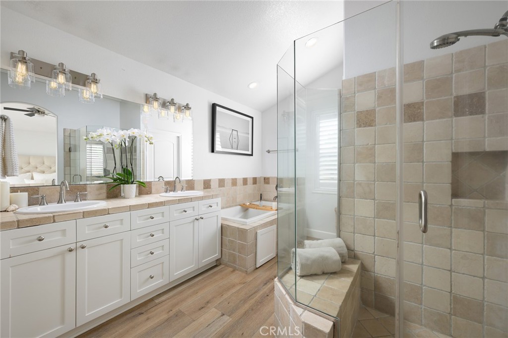 618 Iris Avenue, Unit B Corona del Mar, CA 92625 - Photo 12 of 20 a bathroom with a double vanity sink mirror and shower
