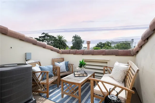 a view of city from balcony with furniture