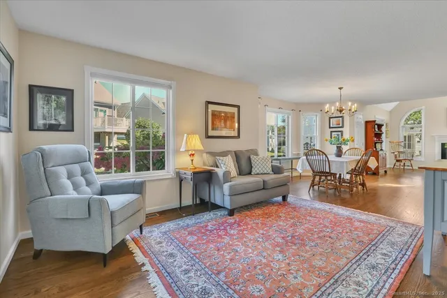 a living room with furniture rug and window