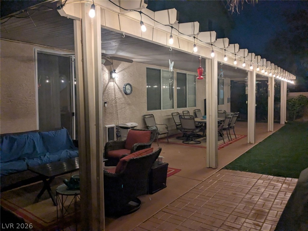 2356 Tilden Way Henderson, NV 89074 - Photo 27 of 30 An inviting covered patio featuring string lights for enchanting evening relaxation.