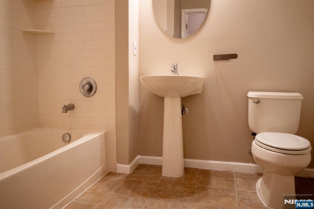 804 River Place Butler, NJ 07405 - Photo 18 of 32 a bathroom with a sink toilet and bathtub