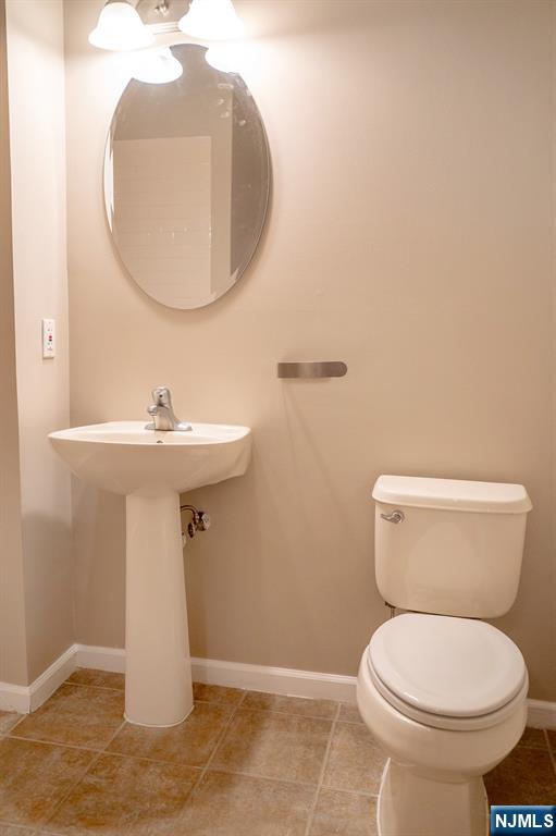 804 River Place Butler, NJ 07405 - Photo 19 of 32 a bathroom with a sink toilet and a mirror