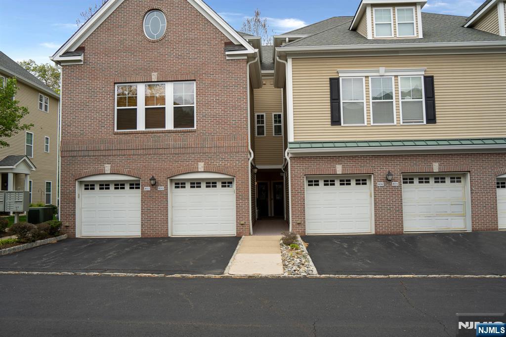 804 River Place Butler, NJ 07405 - Photo 2 of 32 a front view of a house with a yard and garage