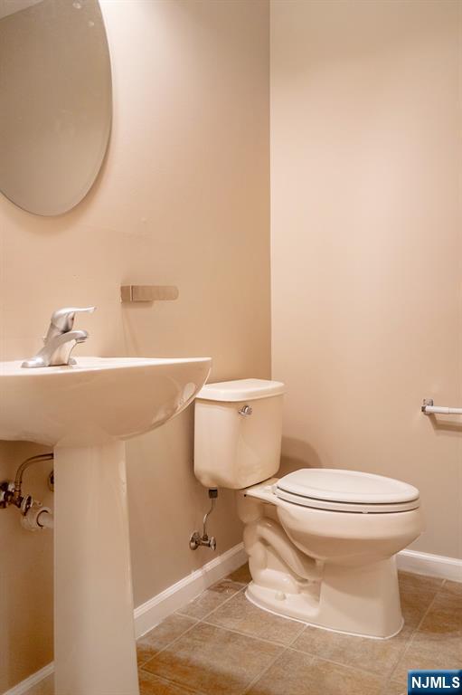804 River Place Butler, NJ 07405 - Photo 22 of 32 a bathroom with a sink and a toilet