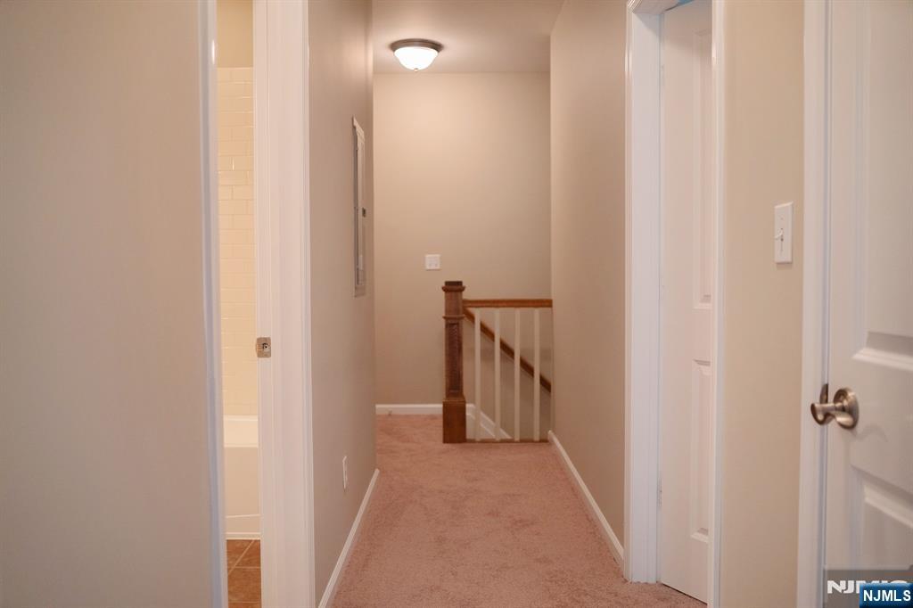 804 River Place Butler, NJ 07405 - Photo 24 of 32 a view of hallway with stairs