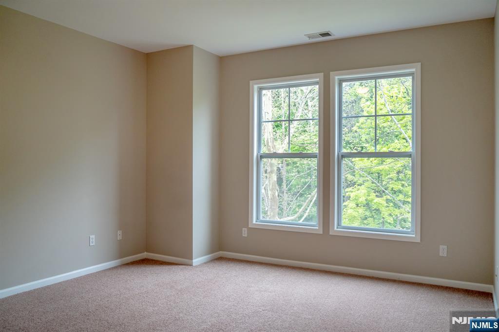 804 River Place Butler, NJ 07405 - Photo 27 of 32 an empty room with windows